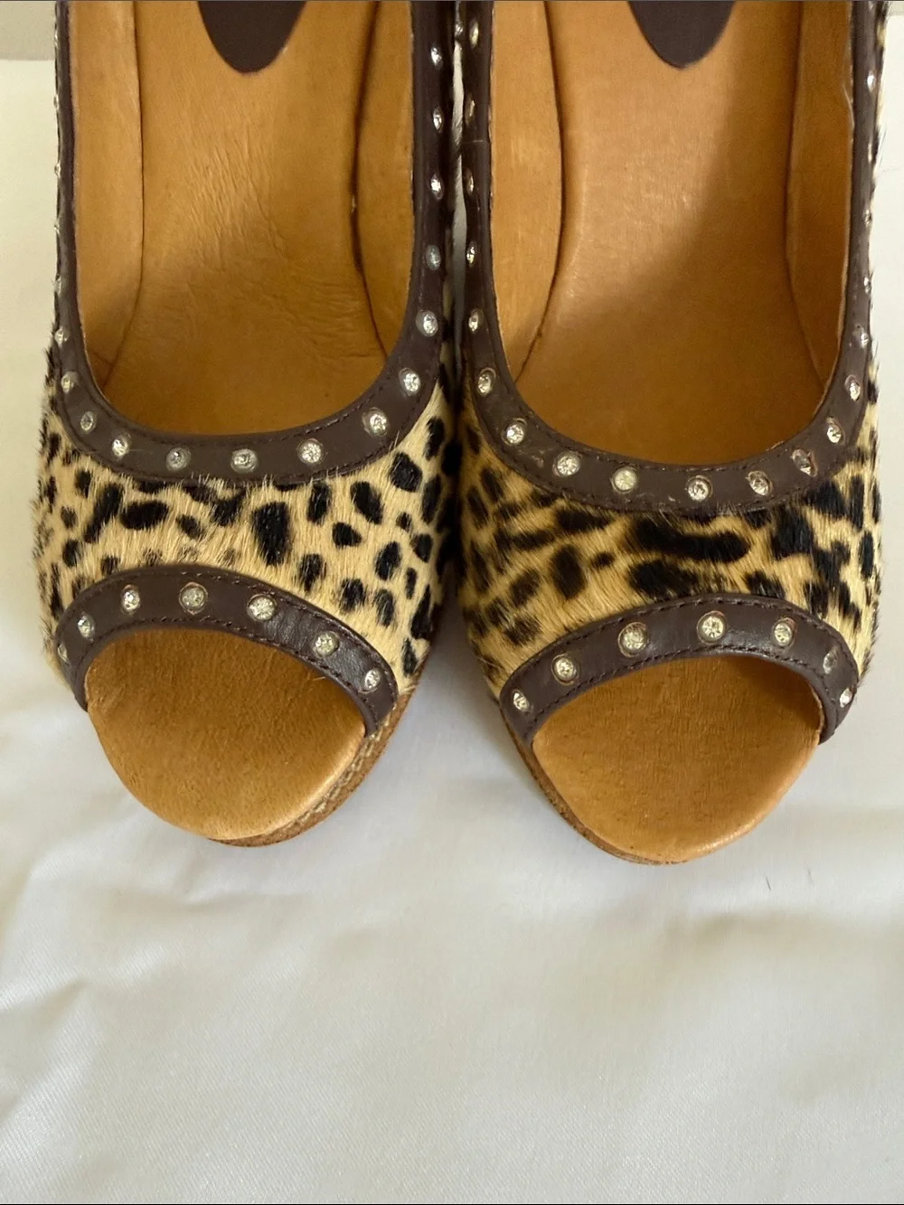 Animal print wedges with rhinestone trim. Leather upper size 8.